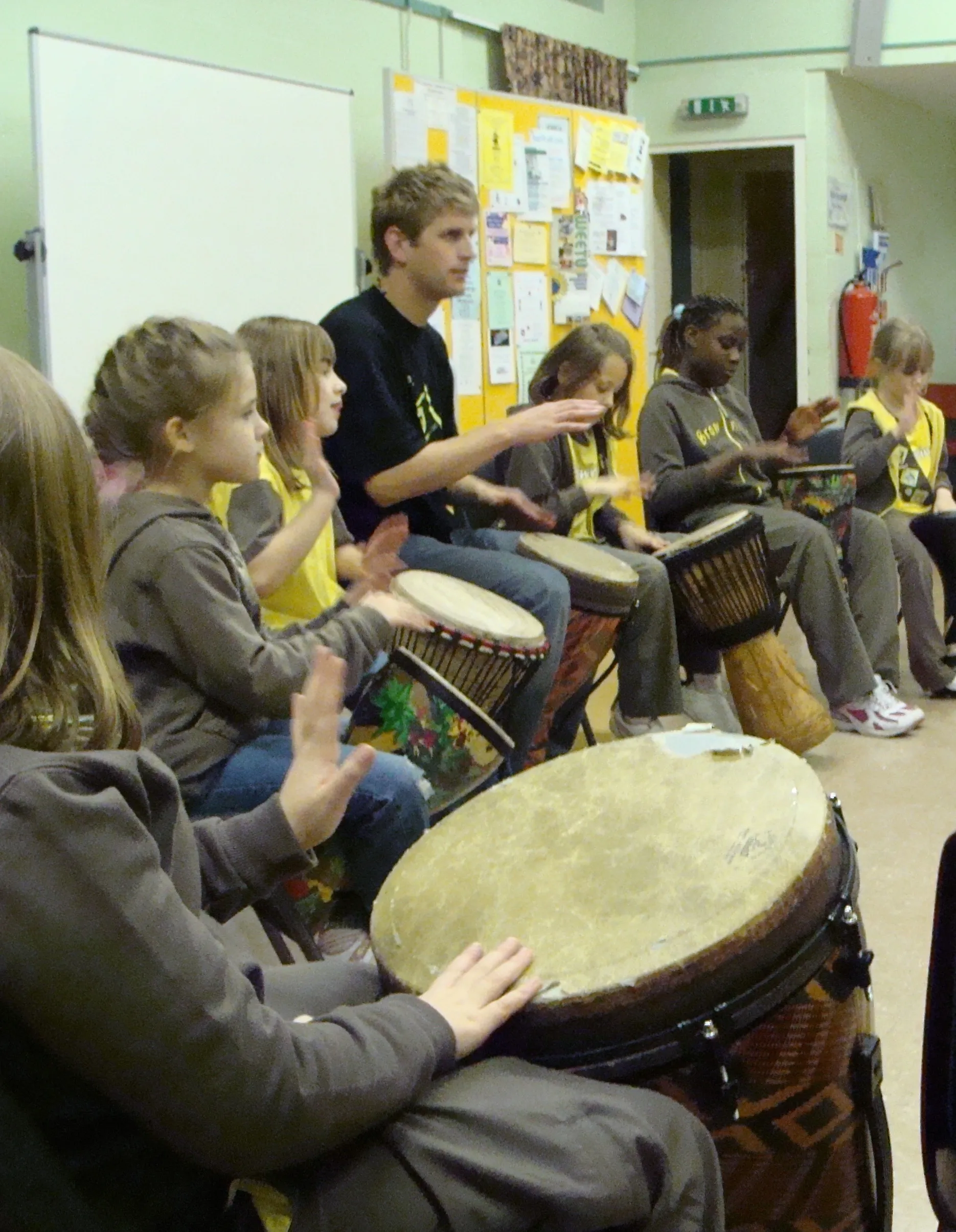 Blake leading an outdoor drumming workshop